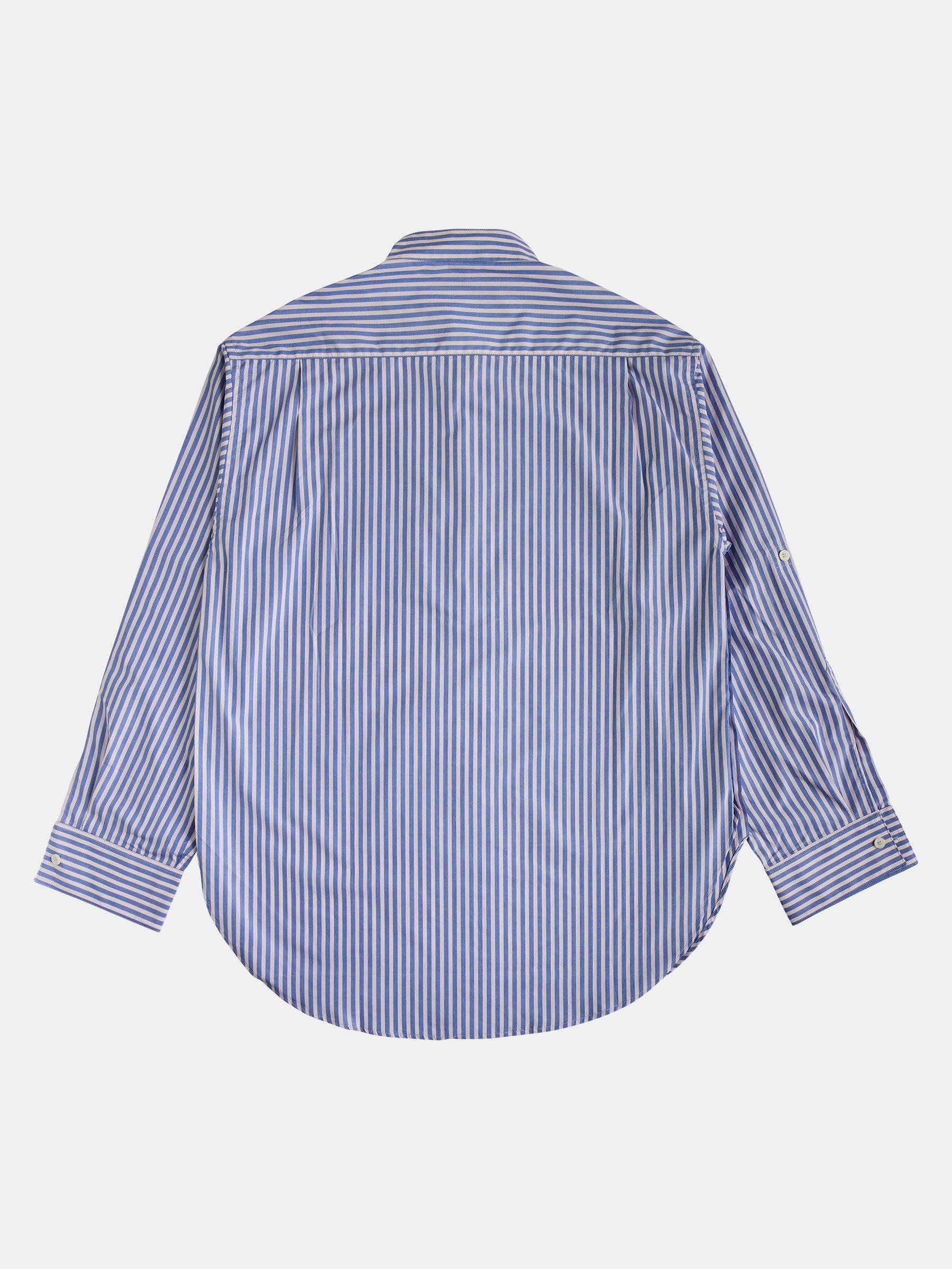 The Oversized Mao Collar Shirt by gabrielstunz is presented flat, showcasing its premium fabric with light blue and pink stripes. The shirt features a contemporary design, complete with a curved hem and buttoned cuffs, adding a modern touch.