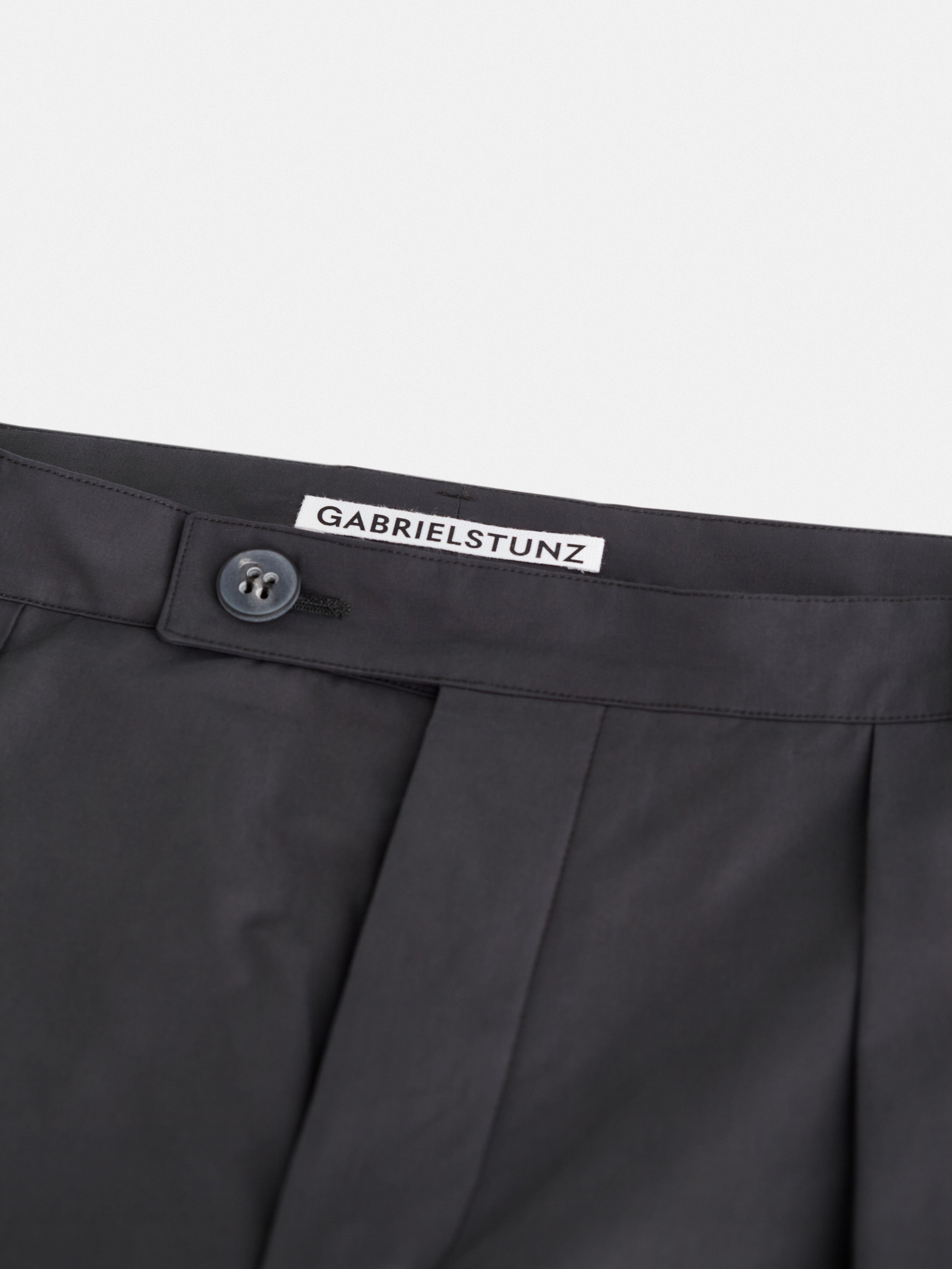 buttoned waistband detail on tapered trousers Autumn / Winter 2025 Puffer Jacket by Gabriel Stunz